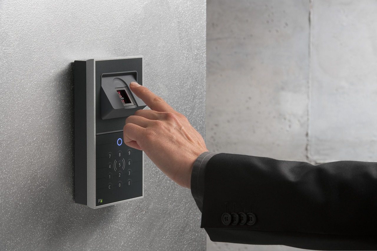 A finger touching a fingerprint sensor - biometrics are the "something you are" factor.